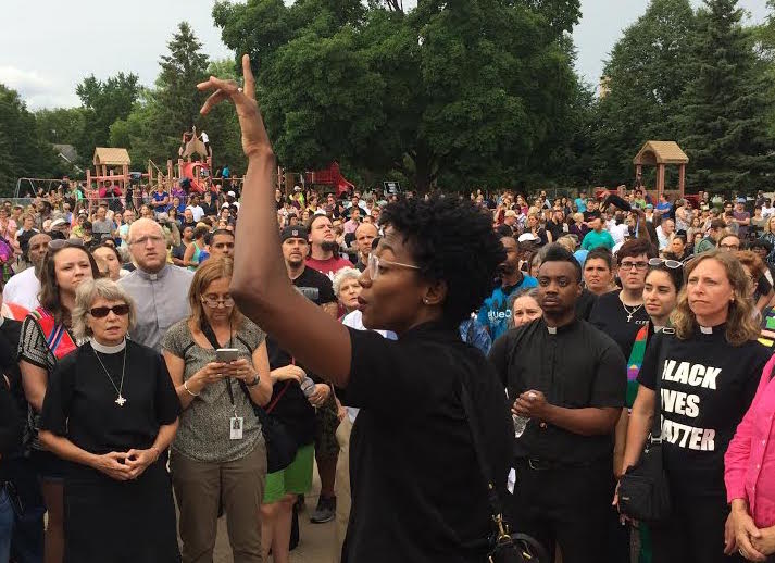 Dee McIntosh, who is in the initial stages of planting Lighthouse Covenant Church in Minneapolis, organized clergy during a vigil Thursday night at the school where Philando Castile worked. She is one of the core leaders of Black Clergy United for Change and Black Lives Matter in the city. Photo by Dan Collison