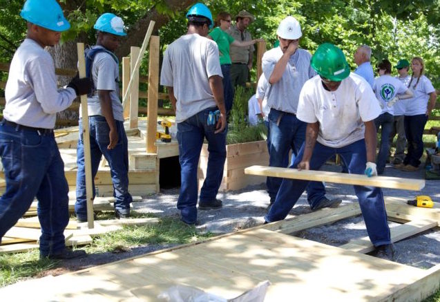 Volunteers building footbridge